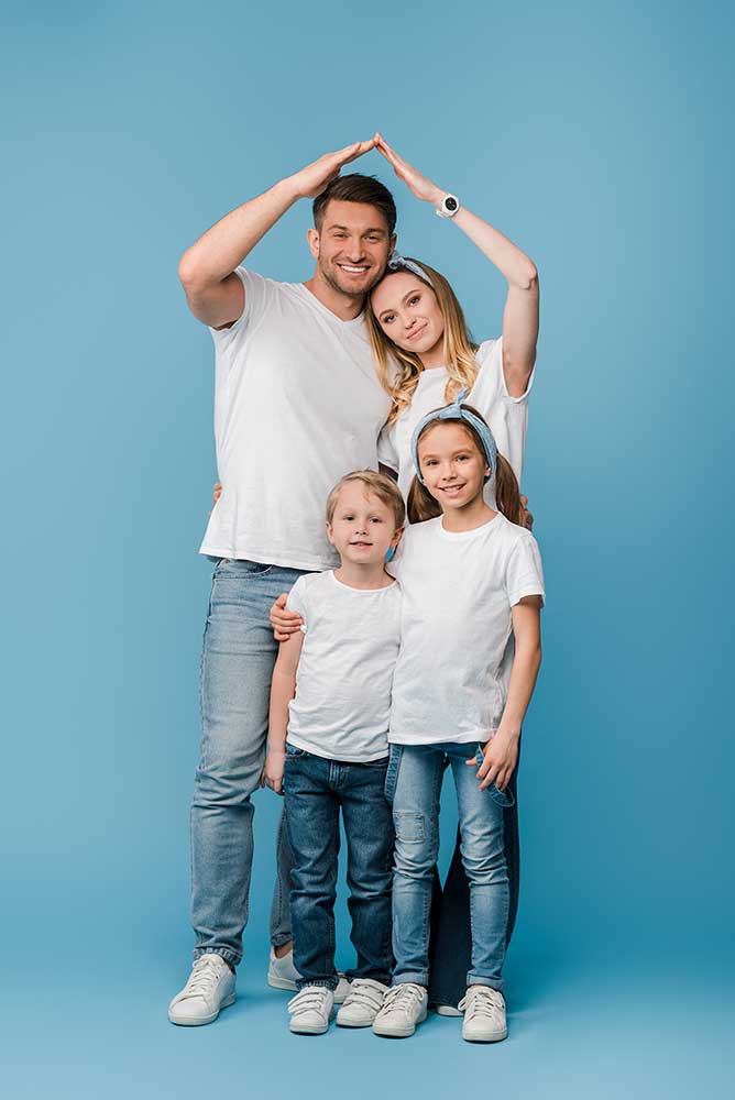 Happy family posing with love on blue background.